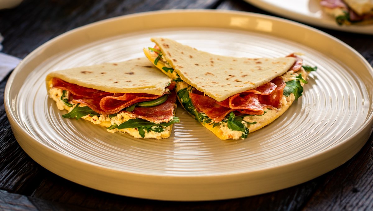 crostamollica's tweet photo. Filled and folded Piadina are Emilia-Romagna’s answer to a lunchtime sandwich, try salami, ricotta and rocket for a traditional filling. Assembled in only 15 minutes this is an easy lunch that can be sliced and served to the whole family🍴#AltogetherItalian https://t.co/LlDEq7FiHd