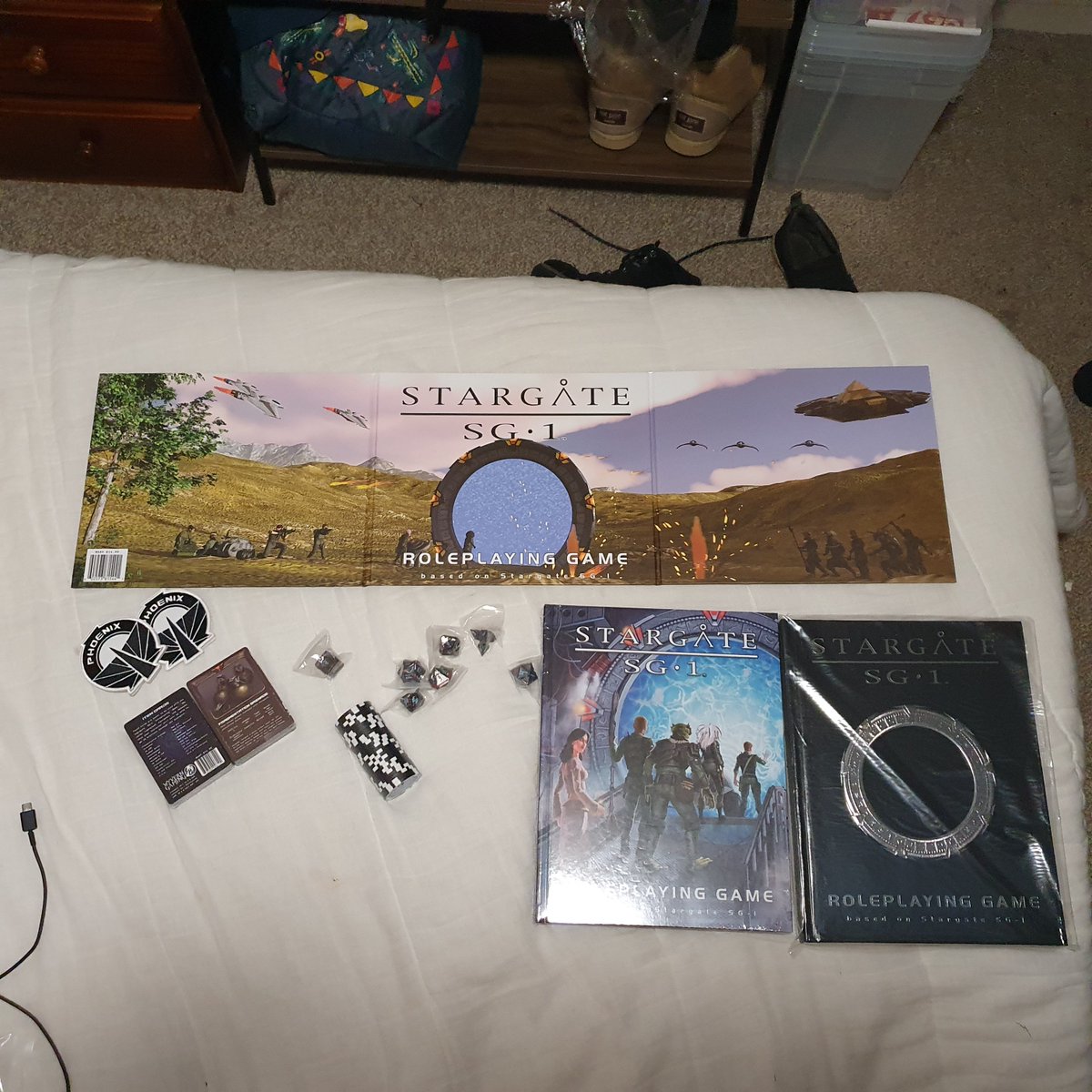 RAMdom_fandom's tweet photo. This (finally)arrived today! Super, indescribably excited. Now I just need to recruit my team. @WyvrenGaming #StargateRPG #Stargate https://t.co/uVWxchh7rA