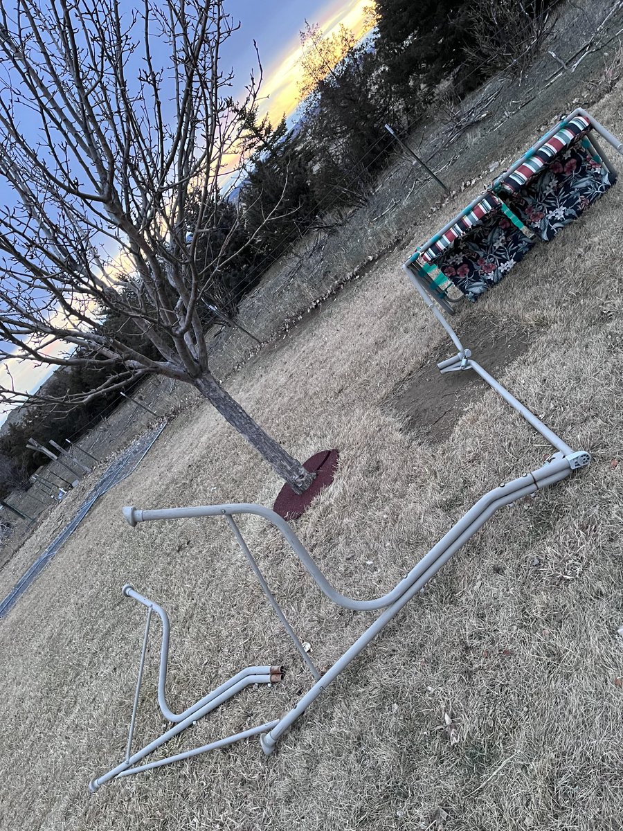 sconepig's tweet photo. The wind at work, disassembling swinging lawn chair. https://t.co/GFbMpZragy