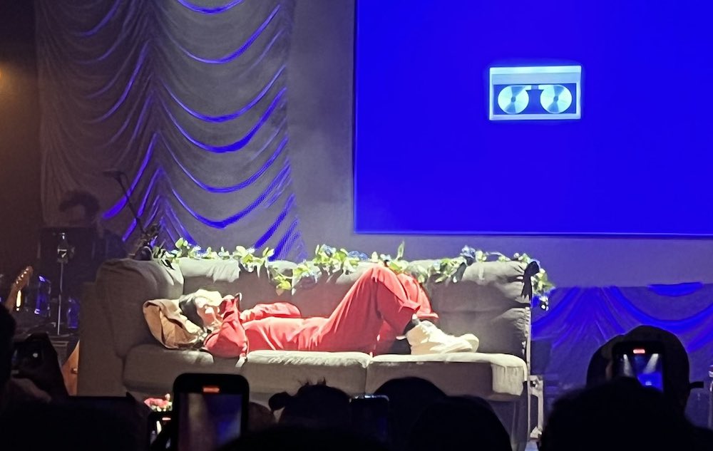 stereogum's tweet photo. Because of herniated discs, @LucyDacus played her Detroit show lying on a couch https://t.co/nsG2d8j2Mh https://t.co/wl1rKm76vx