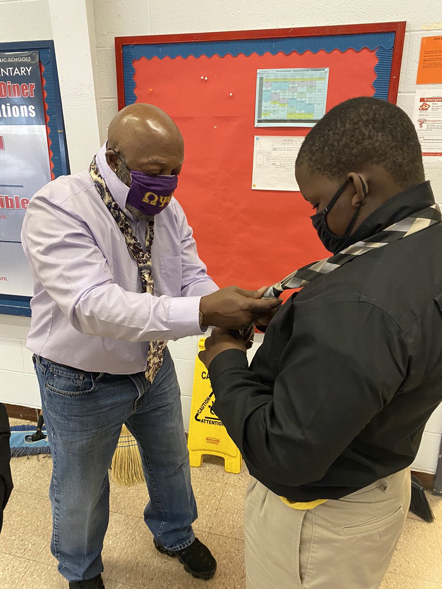 DixieDragons082's tweet photo. The young men of Men of Quality engaged in a rites of passage activity today … learning to tie a tie. Many thanks to the men of Omega Psi Phi for being a part of the village. It matters! @MichelleSircy @JCPSAsstSuptASP https://t.co/nHoyux2wWV