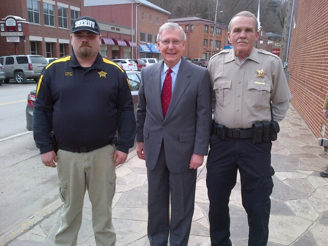 McConnellPress's tweet photo. .@LeaderMcConnell is proud to meet with #Kentucky’s public servants and discuss ways to keep the Commonwealth safe. In 2014, he visited Leslie County and spoke to the county’s law enforcement officers about issues facing their community. #Bluegrass120 https://t.co/mDBiFBZIYk
