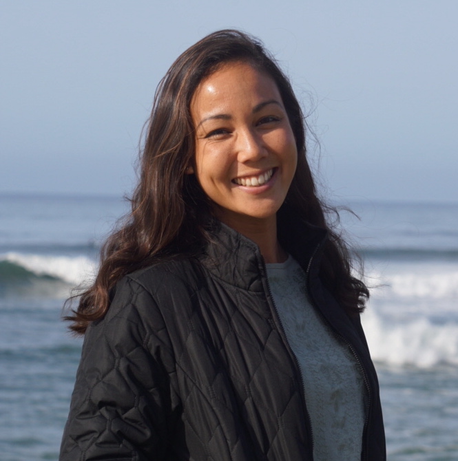 Portrait of a smiling woman at the beach.