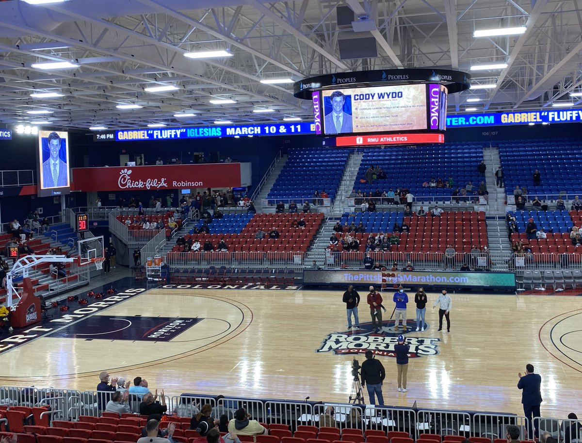 ColonialHF's tweet photo. The @RMUAthletics hall of fame class was just honored during halftime of the RMU Men’s Basketball game! Congrats to hockey alums Rebecca Vint and Cody Wydo! https://t.co/PSuU06tRRD