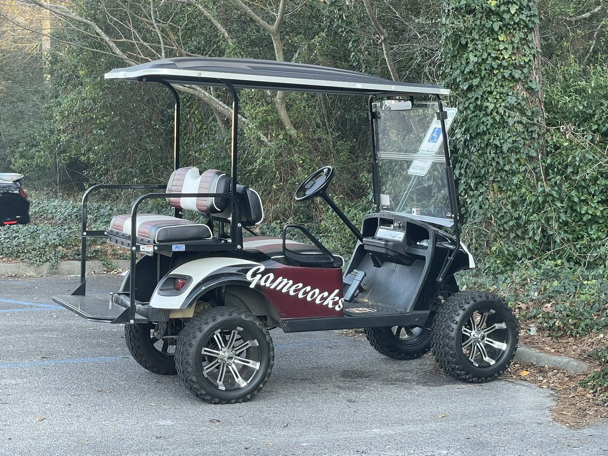 Mike_Uva's tweet image. Not sure whose golf cart this is parked outside of the gym in Forest Acres but I like their style