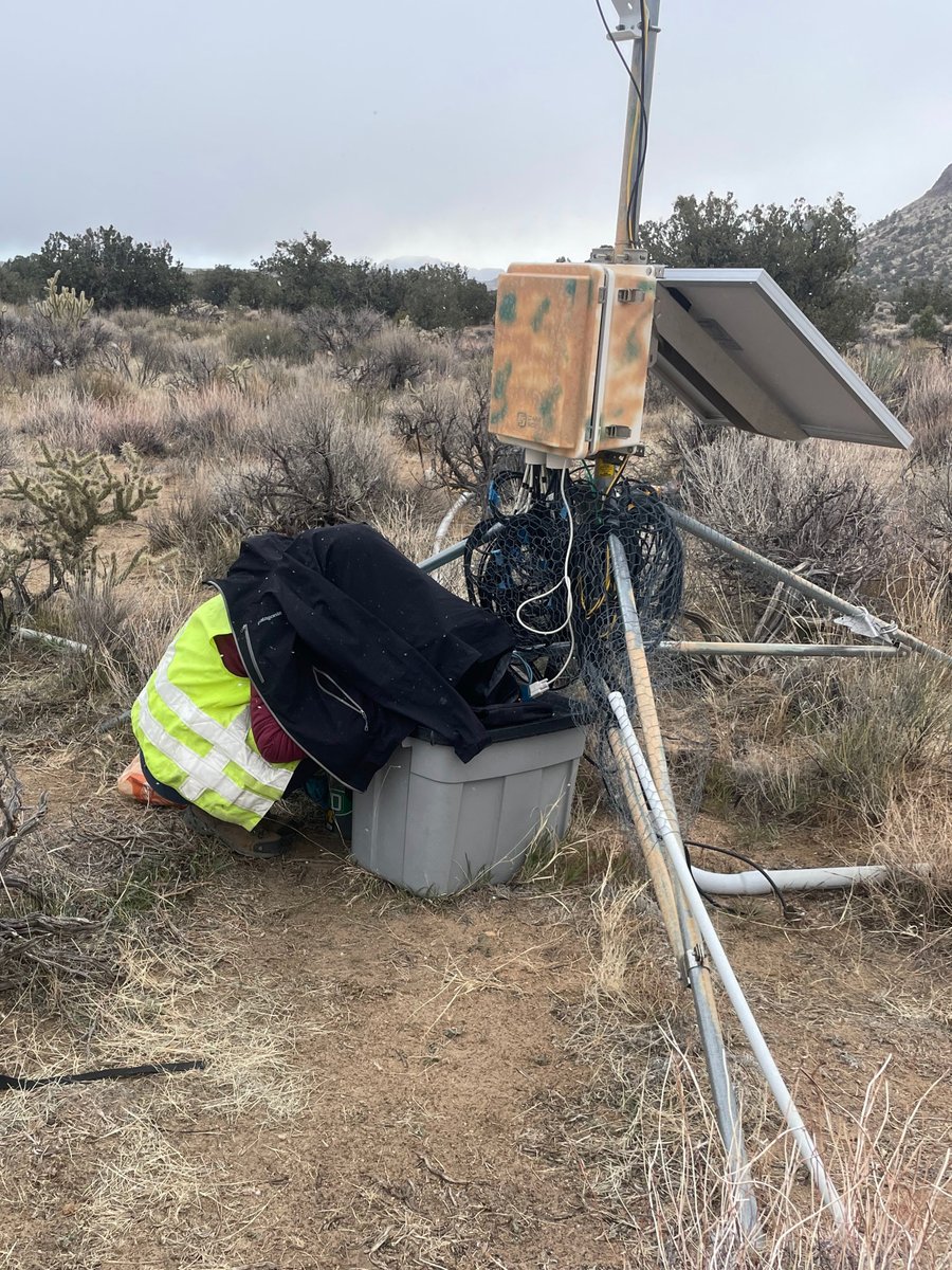 Find the scientist in this picture: In the most recent episode of #CZ17O fieldwork, a snowstorm blew through the Mojave Desert while Postdoc <a href="/GeochemJulia/">Dr. Julia Kelson</a> was trying to repair wires and log data at our highest elevation site in a Mojave Desert Climosequence.