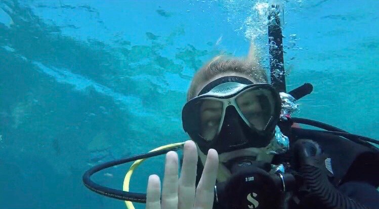 A woman scuba diver underwater.