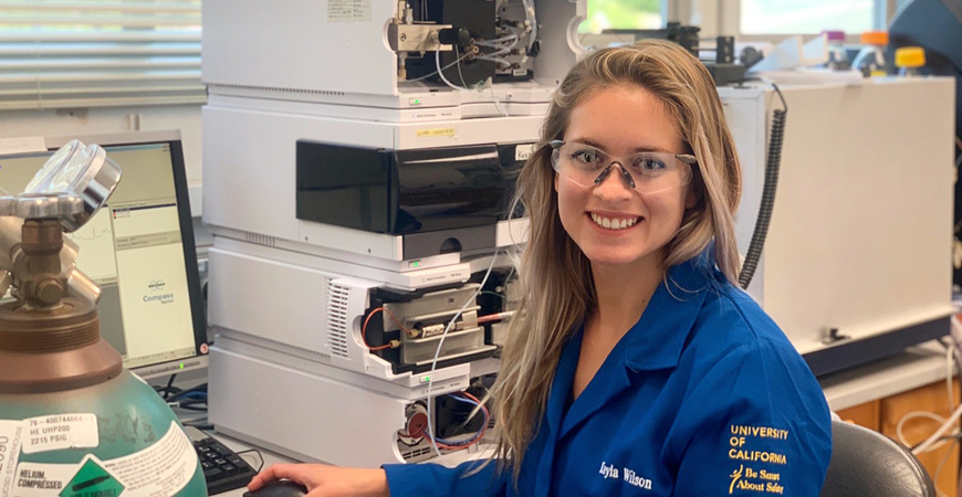 A woman scientist works in a lab.