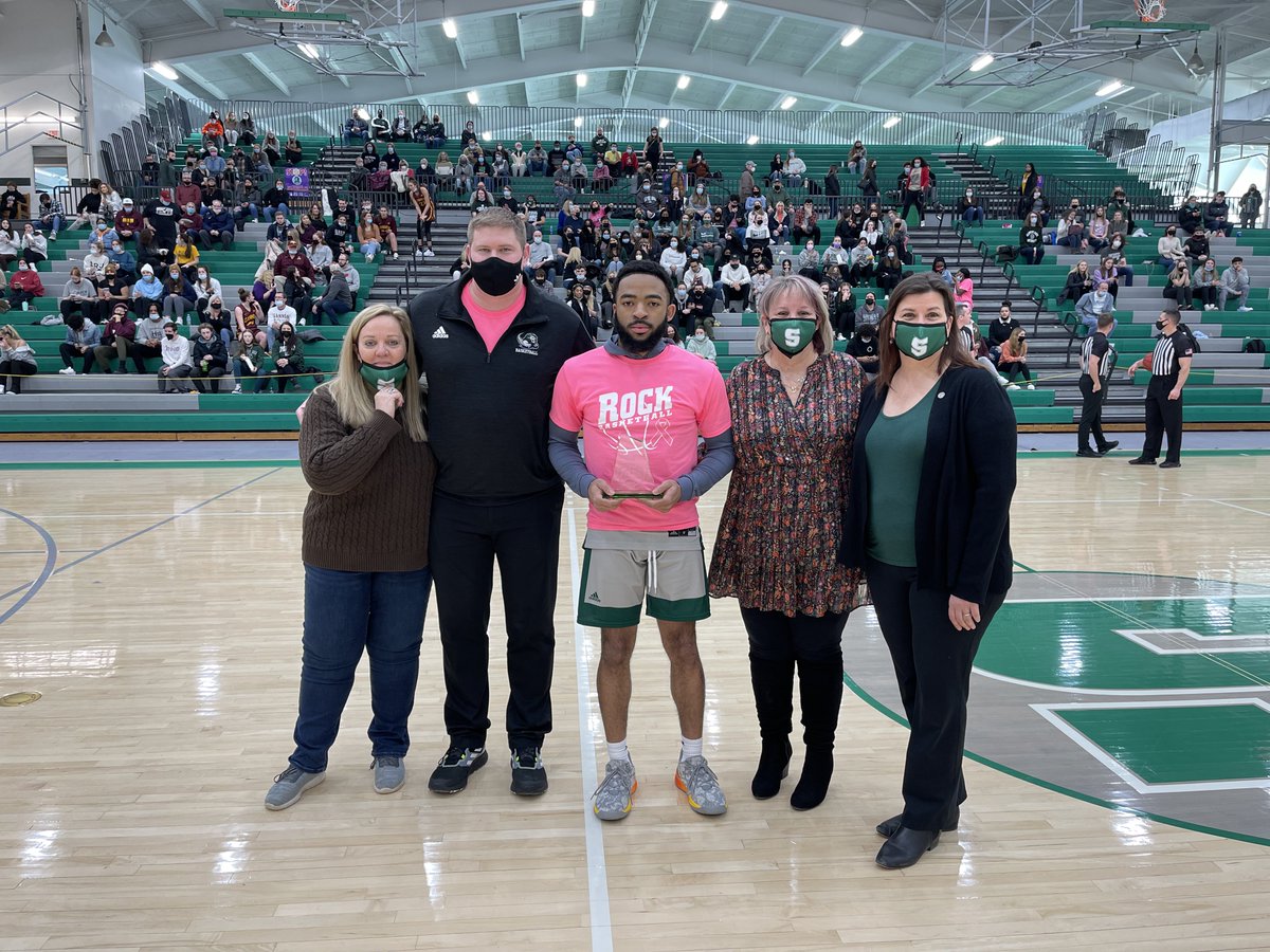 Rock_Athletics's tweet photo. MBB: Before today’s game, Amante Britt was presented with the Pop Knauss Scholarship by members of Pop’s family. https://t.co/mbGj6ahRIa