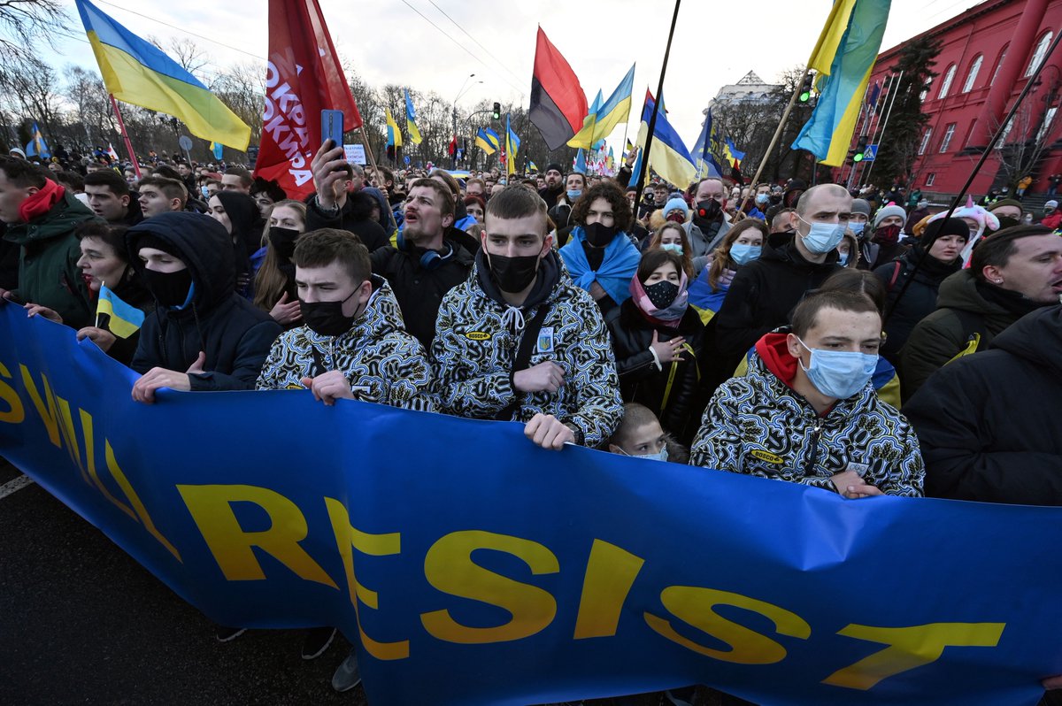 Thousands marched in Kyiv on Feb. 12 to show unity against the Russian threat.

People filed through the city center chanting “Glory to Ukraine” with Ukrainian flags and banners that said “Ukrainians will resist” and “Invaders must die.”

📷 AFP via Getty Images