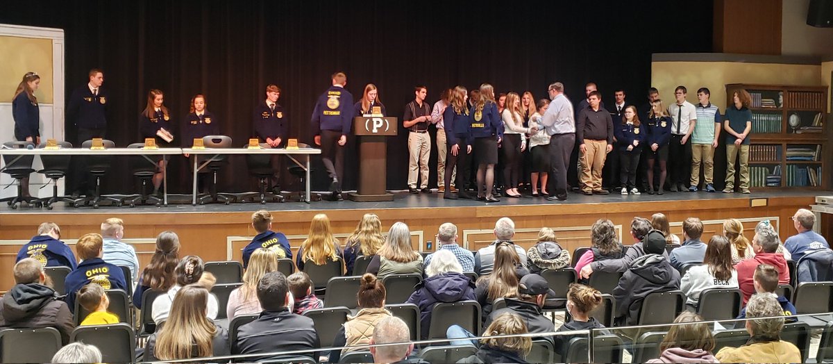 Pettisville FFA advisor, Mr. John Poulson, presents the Greenhand pin to FFA members who have earned this special recognition.  Congratulations!!!