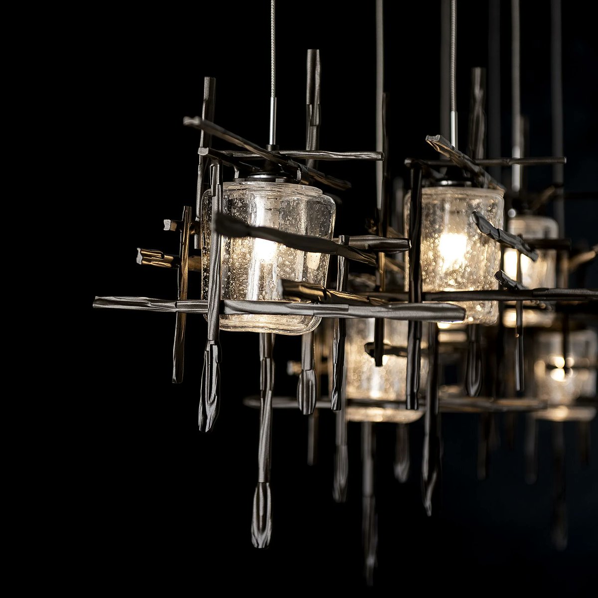 Tura 7-Light Seeded Glass Rectangular Pendant

A linear multi-port pendant, this 7-Light Tura with its rectangular canopy offers both depth and dimension. Each intersecting piece is crafted from annealed aluminum that are hand textured using a trip hammer and custom dies.