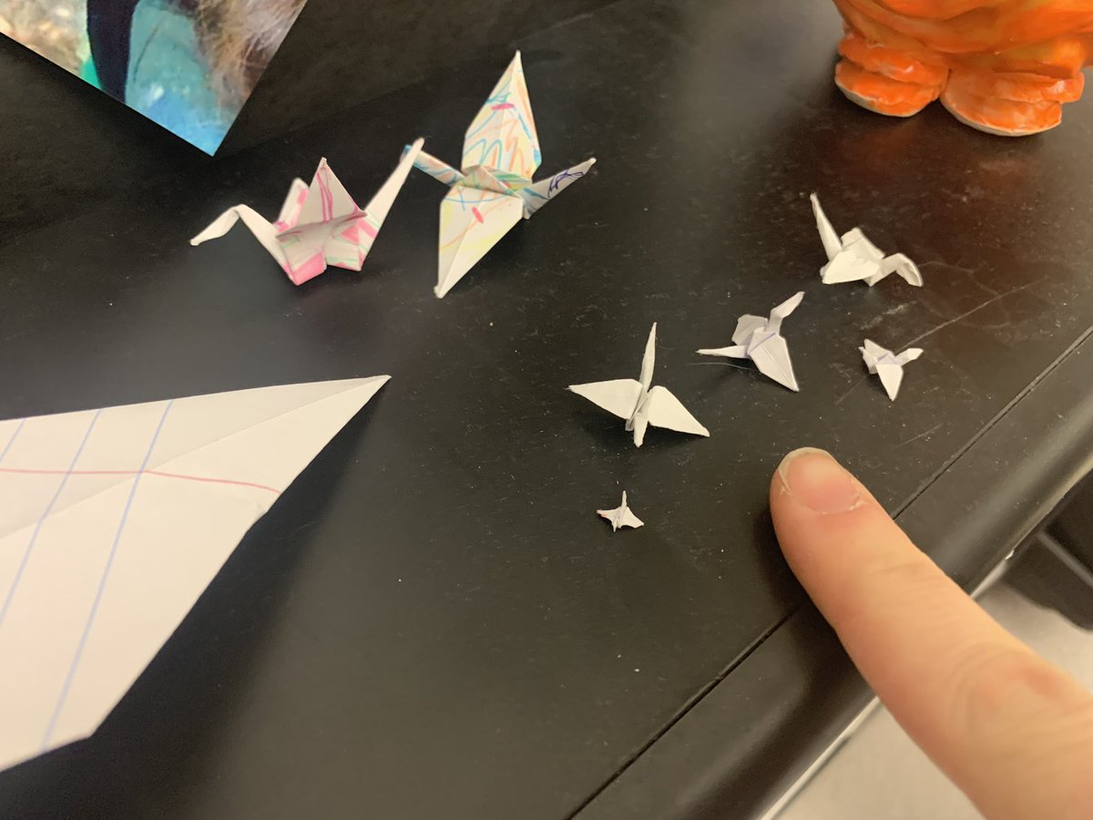 One of my students makes me these paper cranes during lunch and learn. This week she decided to see how small she could make them. I included my finger for scale.

The shocked reactions of other students when they saw how small her finished products were was priceless!