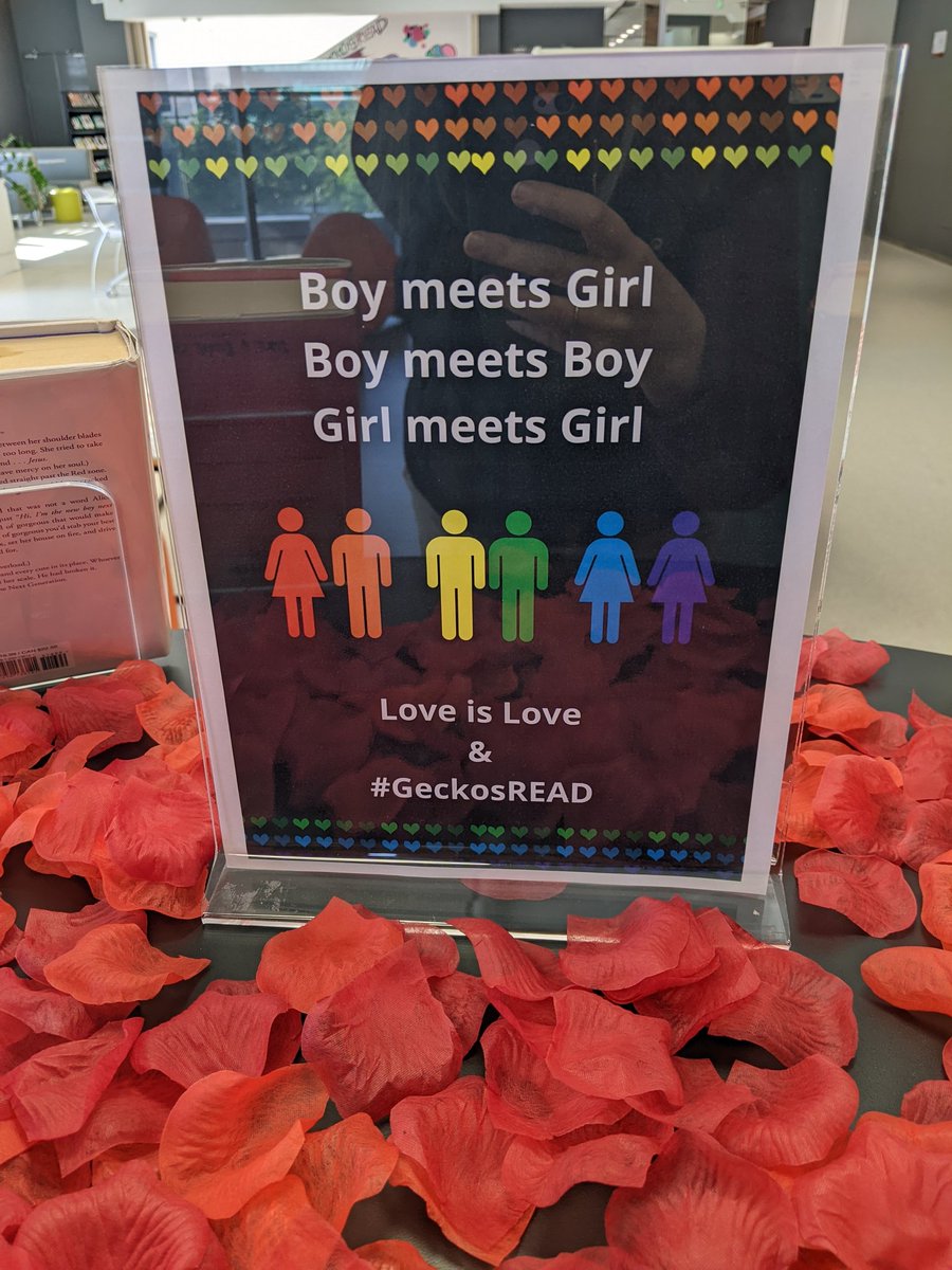sducharme's tweet photo. New book display: "Love is Love" in the MS/HS Library at #sisRocks - #GeckosRead! https://t.co/di70kHZwwJ