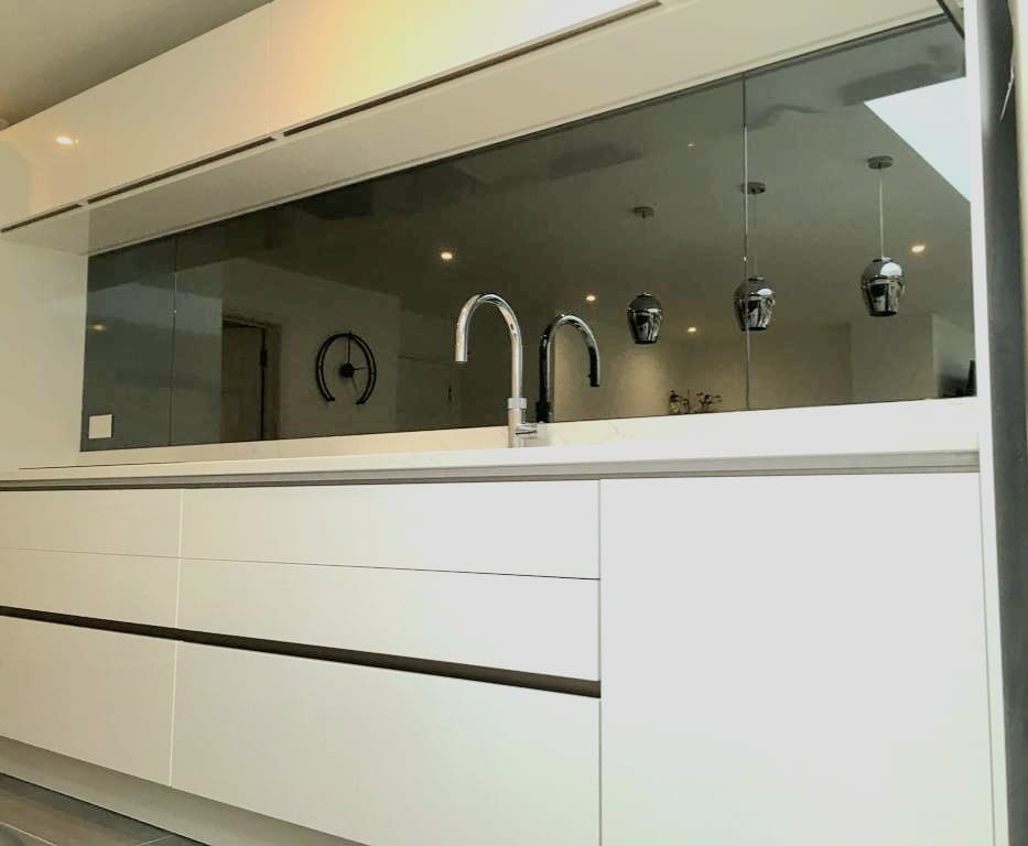 Mirror splashbacks can help bring more light into the room making your space feel bigger. ✨ Check out this grey mirror splashback recently installed by the team! 

For more info, send us a DM or visit us at our showroom!  ⠀
📍5 Crookham Rd, Fleet GU51 5DJ