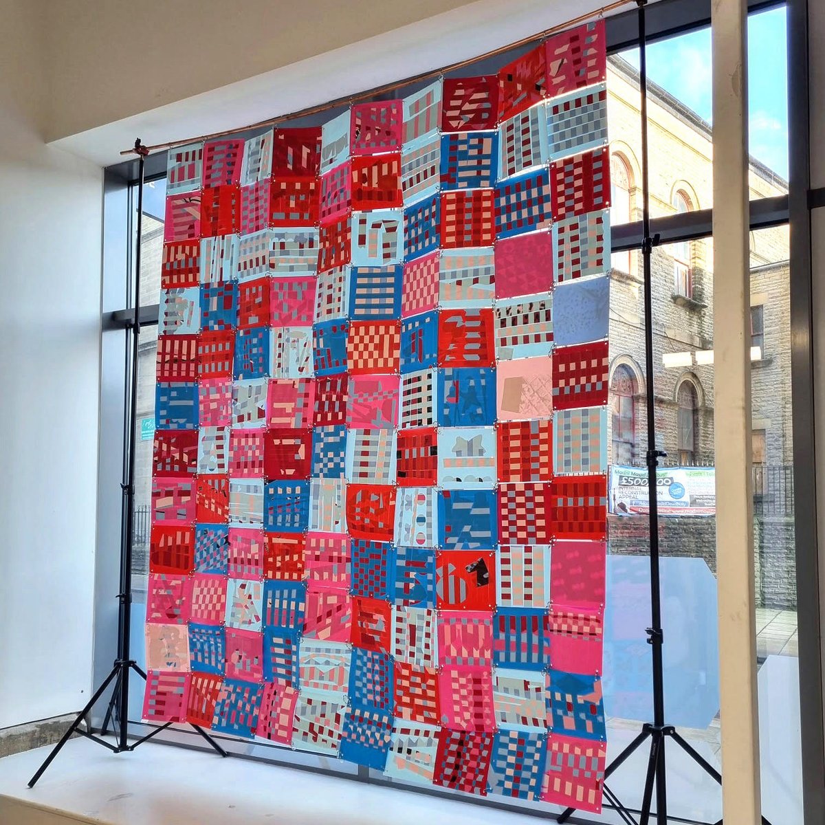 dewscreative's tweet photo. Look at the amazing community paper quilt on display at Pioneer Higher Skills Centre @kirkleescollege  This was made by the people of Dewsbury at The Shoddy Factory and will be on display throughout Feb! 
#creativetown #dewsbury #shoddyfactory #patchworkproject #publicart https://t.co/pTCPP4kUkD