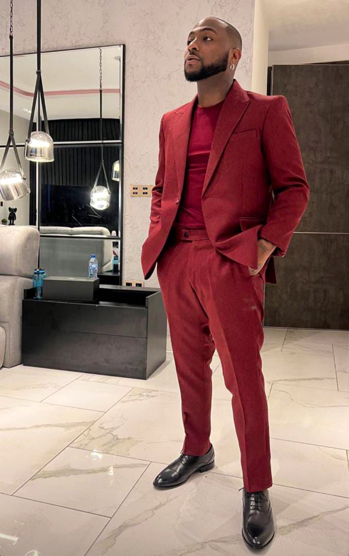 burgundy suit with black turtleneck
