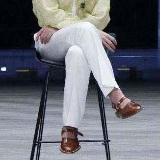 he sits in extremely pretty