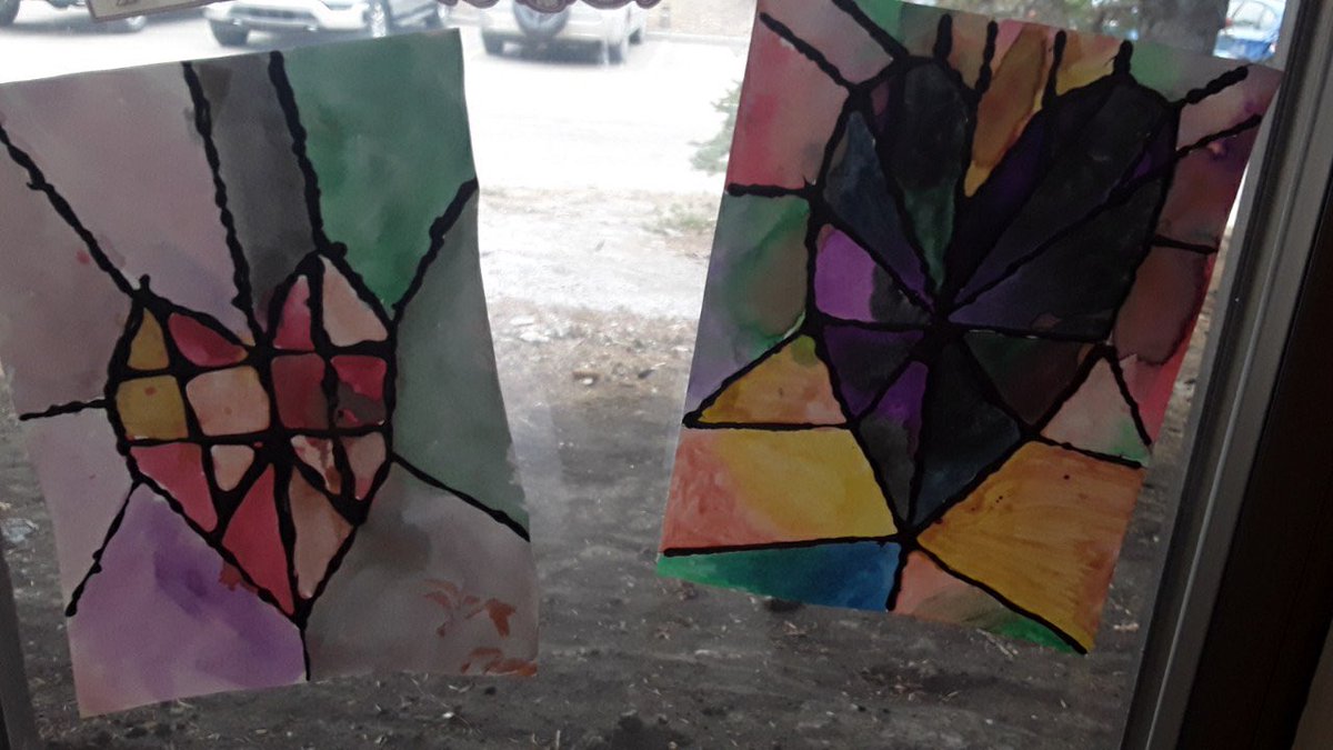 Beautiful stained glass art work created by 4U <a href="/GlenbowSchool/">Glenbow Elementary School</a> using techniques with black glue and  watercolors.