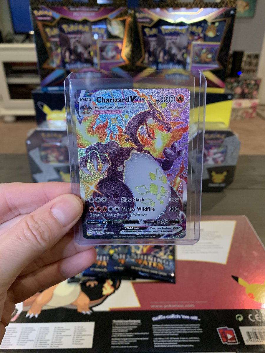 PirateNation22's tweet photo. What is my 🍀 right now? Just bought a few SF ETBs to chase this big boi & FIRST FREAKING PACK??? And after I just pulled the alt art Dragonite yesterday lol! UNBELIEVABLE! 🔥✨✨🔥 #Pokemon #PokemonTCG #shiningfates #shinycharizardvmax #charizard #shiny https://t.co/UKua612ayL https://t.co/HFRgrzc9cw