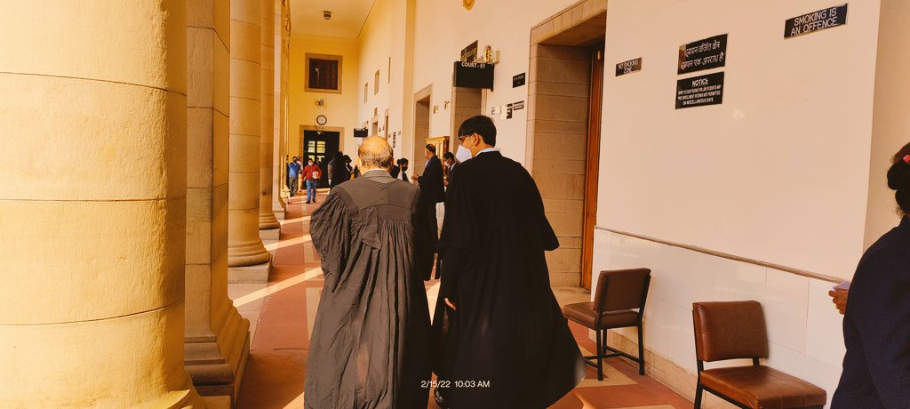 DebayonRoy's tweet photo. After a brief hiatus of #thirdwaveCOVID, Supreme Court of India begins limited physical hearing from today

Lawyers rushing to make entry passes while seniors are being briefed in the court corridors
#SupremeCourt https://t.co/jZoB73AUXO