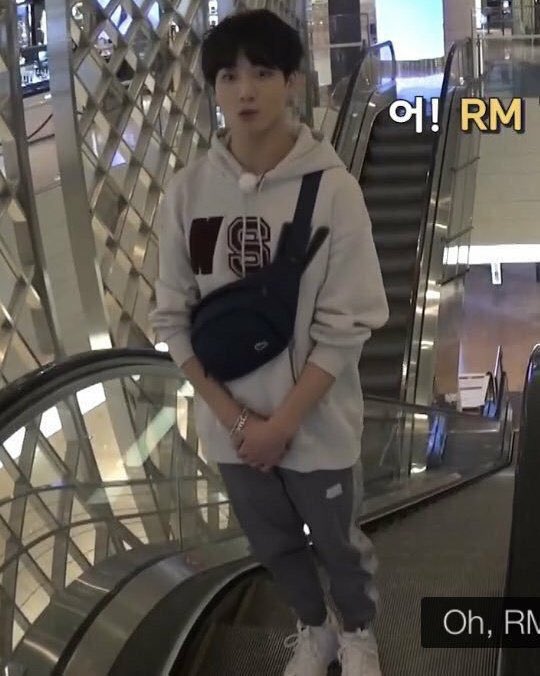 randomjungkook's tweet photo. jungkook standing on escalator politely https://t.co/Fr1I6ooysM