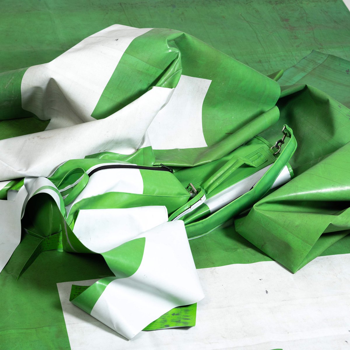 Truck tarp. Why are we using it? Tarp possesses properties that are ideal for our bags. Hardwearing, waterproof and easily cleaned.
Practical uses aside, lorry tarp once it becomes obsolete  is destined for landfill. So every bag we make reduces landfill waste.