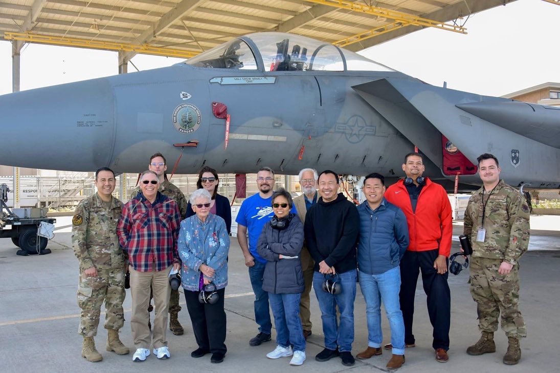 Lt. Col. Cesar Gonzalez, 144th AMXS commander, and Al Alfaro, 144th AMXS honorary commander, lead members of the Sanger Task Force in a tour of the 144th Fighter Wing, Feb. 15, 2022.