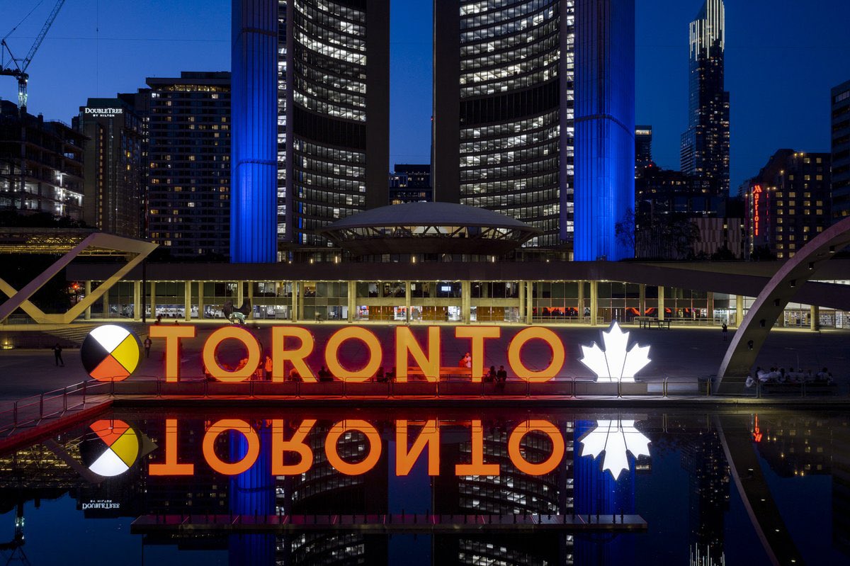 The Toronto Sign will be lit orange this evening through tomorrow in memory of the 54 individuals buried in unmarked graves on the Keeseekoose First Nation at the site of two residential schools, and to honour all those who did not return.