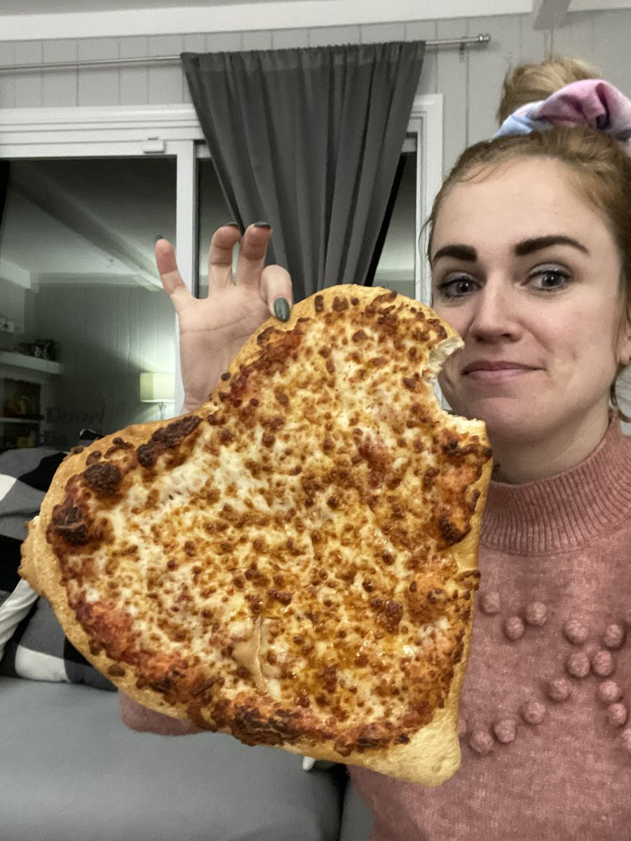 MegAnne's tweet image. The husband was in New Mexico last night, so I thought I’d treat myself to a little @pizzahut moment. ♥️-shaped pizza, you say? I’m in! This is how it came - cold and uncut. I had to snap a pic, because you had better believe I picked up the whole thing and ate it in one.