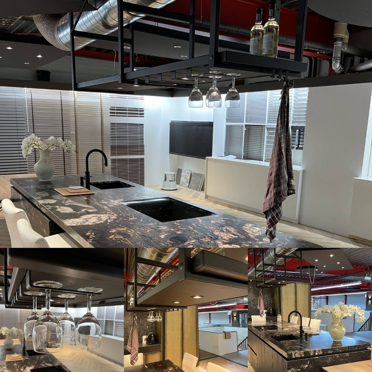 Boven het prachtige keukeneiland van Van Galen Keuken &amp; Bad, in de nieuwe showroom van Noordman Vloer- en Raambekleding, hebben we ons nieuwste model stalen keukenrek opgehangen. Superstrak, voorzien van spotjes en voldoende ruimte voor flessen, glazen en decoratie.