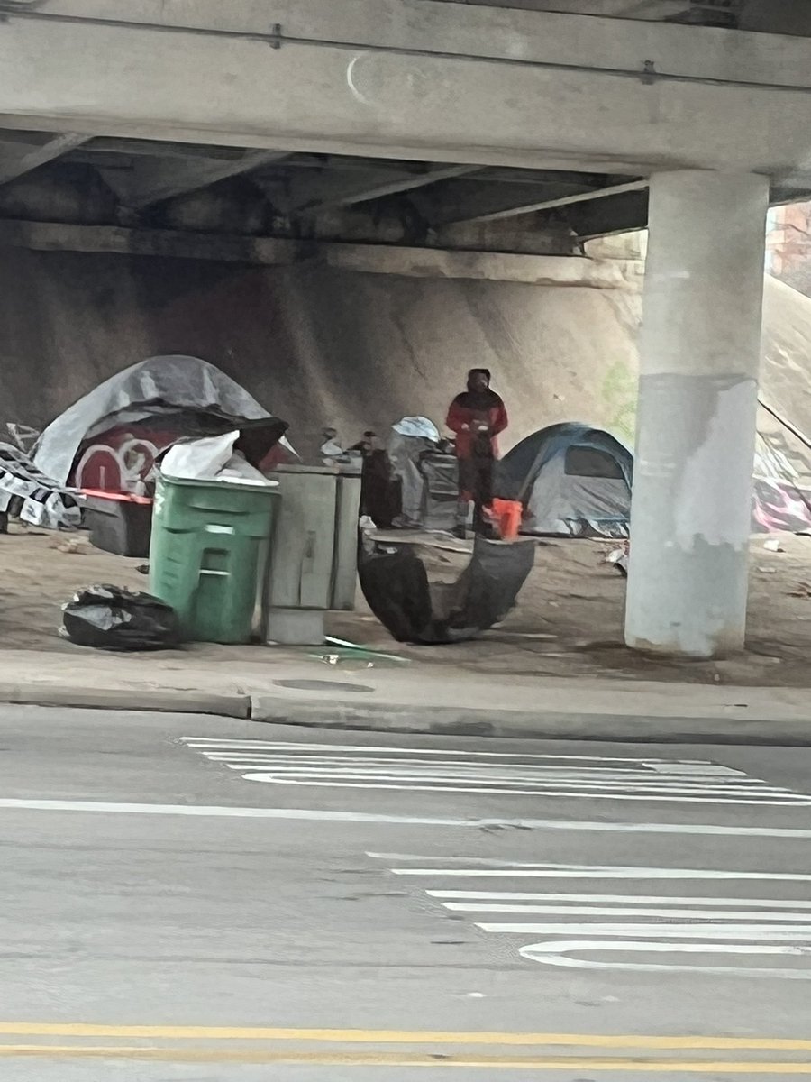 ecman054's tweet photo. @MayorAdler Villages popping up all over the city again! Such a disgraceful leader! @KVUE @KXAN_News why don’t you hold these people accountable? @GovAbbott you’re also part of the problem! @TxDOTAustin clean it up!! https://t.co/TyOgP2a1XU