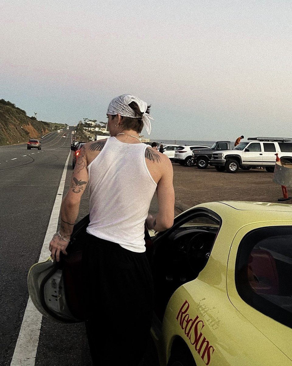 — he’s at a car show with his pride and joy