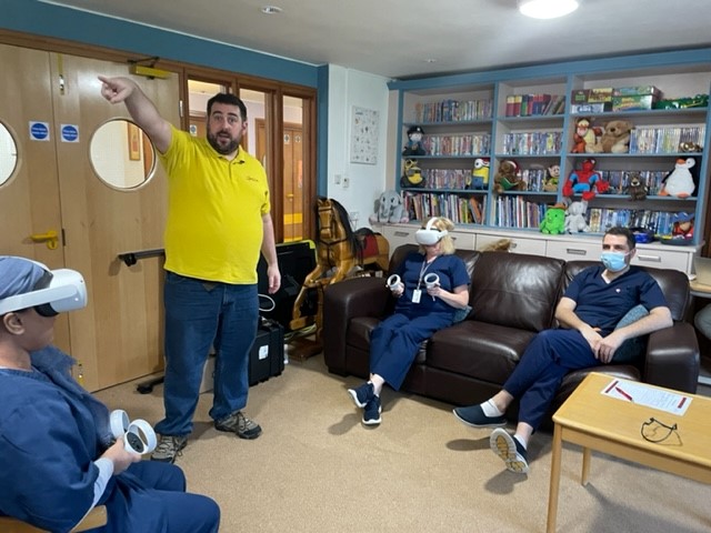 AcornsHospice's tweet photo. A massive thank you to @LifelitesOrg for their recent donations to our hospices. They've been visiting us to provide training in new technology including these VR headsets and a fantastic tilt and touch table which Charlie had lots of fun playing with!. https://t.co/x3on54masO