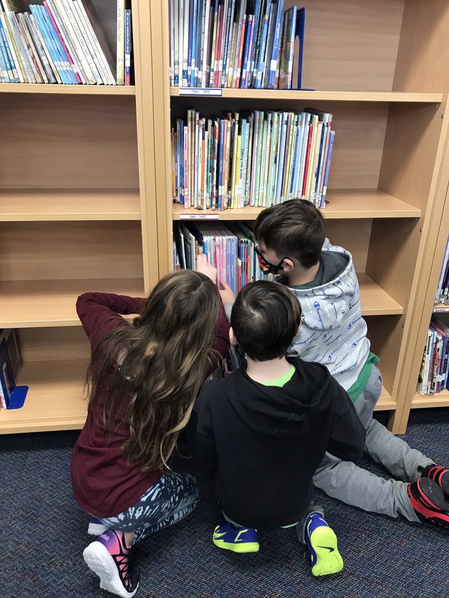 QuashnetLibrary's tweet photo. QS fifth graders using math in the library. They applied their knowledge about #decimals to organize some books. #Mashpee @PrincipalQS https://t.co/Cr3FyXT3jv