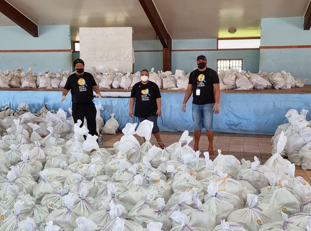 WCKitchen's tweet photo. On board the Tongan Navy Boat, WCK food & hygiene kits were shipped from Tongatapu to Ha’apai—a group of impacted islands 127 miles away. Tonga remains on a Covid lockdown, but with strict safety protocols in place, WCK restaurant partners have resumed cooking! #ChefsForTonga https://t.co/FGamd0POIM