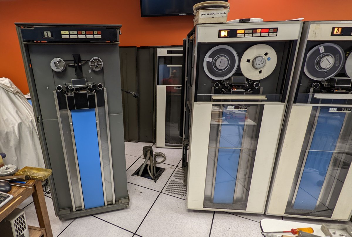 kenshirriff's tweet image. Today's maintenance @ComputerHistory. We tried to disassemble the vintage IBM tape drive to fix a bad clutch. The front hub is held on by a tiny pin, but we couldn't get the pin out, despite the use of a large hammer. So the drive is partially disassembled until next time. 🧵