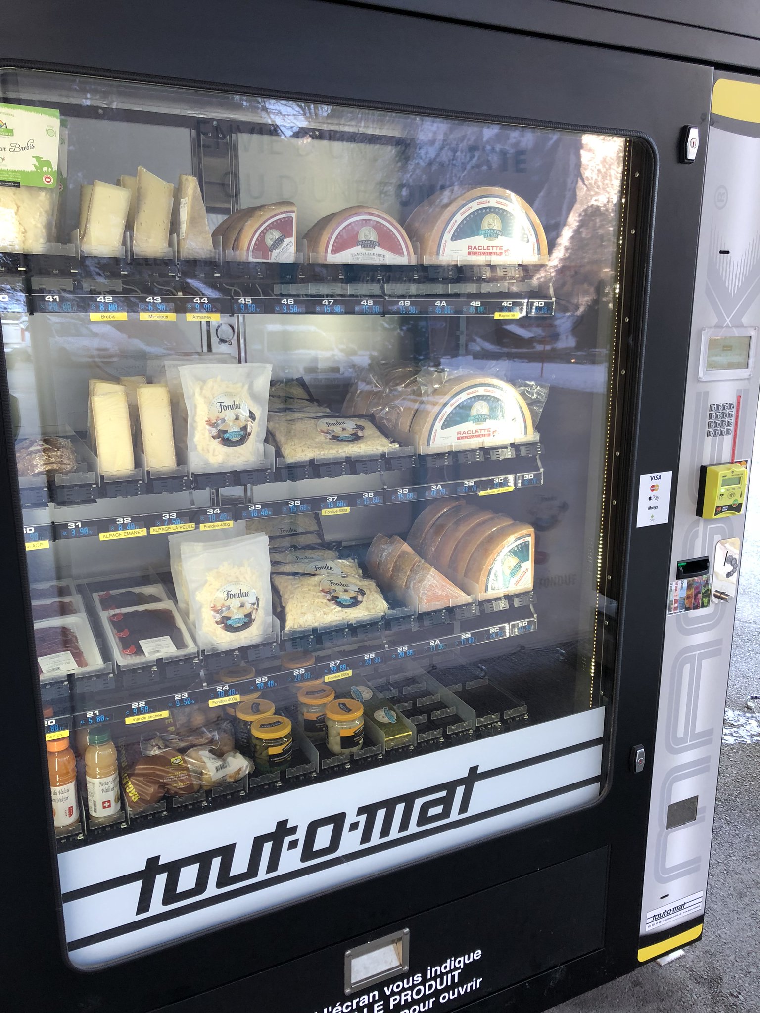 A cheese vending machine in a mountain village in Switzerland :  r/mildlyinteresting