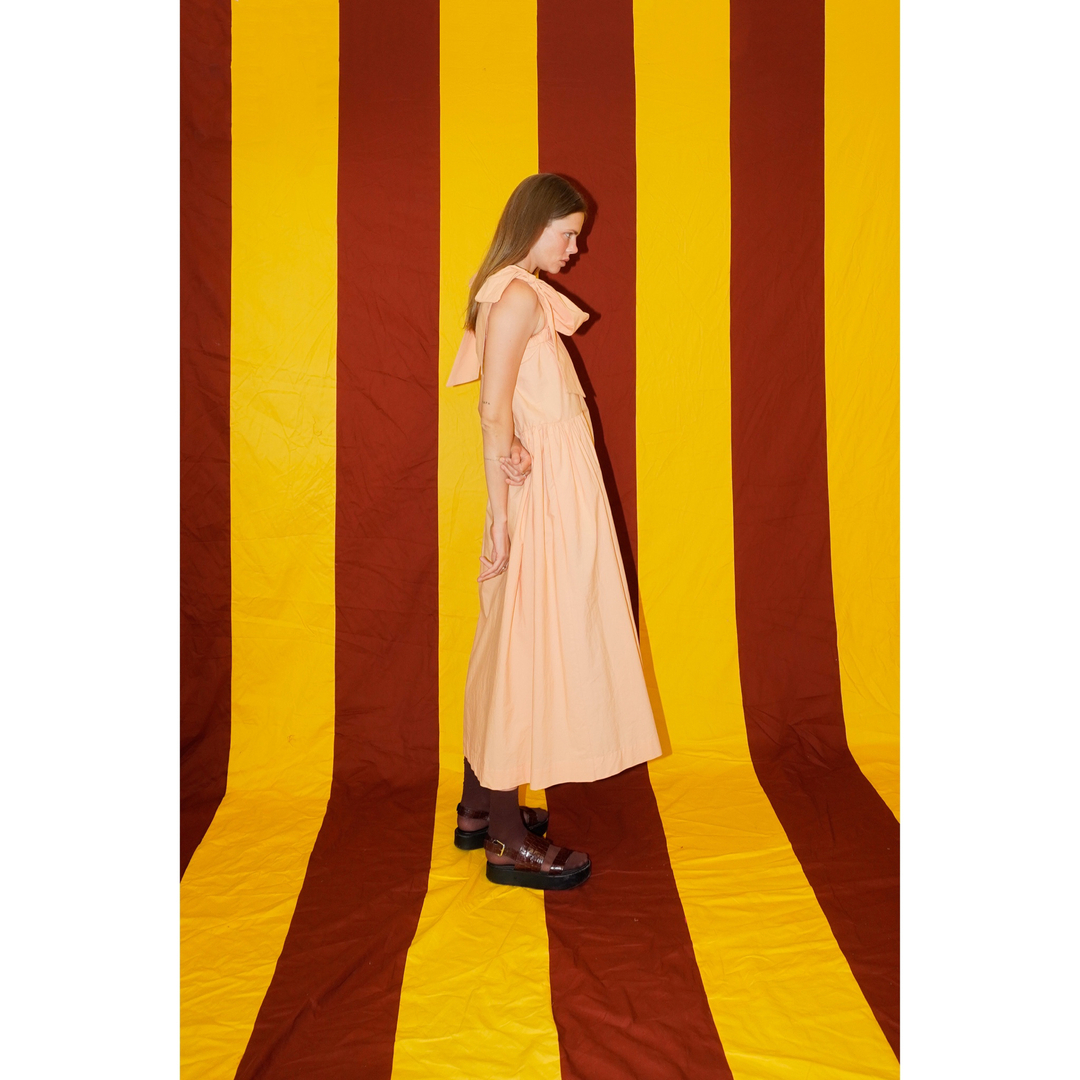 Nina wears the Peach Bow Dress. Available at akjpstudio.com and at AKJP Studio on 73 Kloof Str, Cape Town.​​​​​​​​

@_akjpstudio​​​​​​​​
⠀�