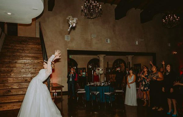 Considering it’s Wedding Wednesday, we want to talk about one of our favorite wedding day traditions: tossing the bouquet

Did you know that it originated in England and that after the wedding ceremony, guests would try and rip off pieces of the bride's dress or bridal bouquet?