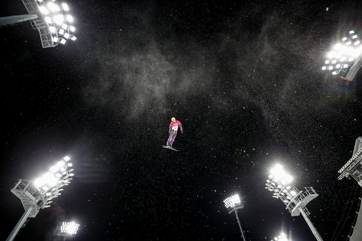 There is a lot of time spent in air by athletes at the Winter Olympics. I shot the mens aerial finals last night. Here’s some Russian lad up looking at the flood lights