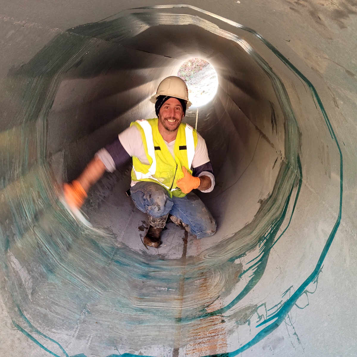 LegacyTowers's tweet photo. What's Johnathan doing inside a monopole section just before the crane lifts it up? He's slathering the bottom section with dish soap (really!) to help it slide down into place. Let's stack this thing!! #LegacyTowers #ServiceWithASmile #BuildingBetterBandwidth https://t.co/2BVefLOlor