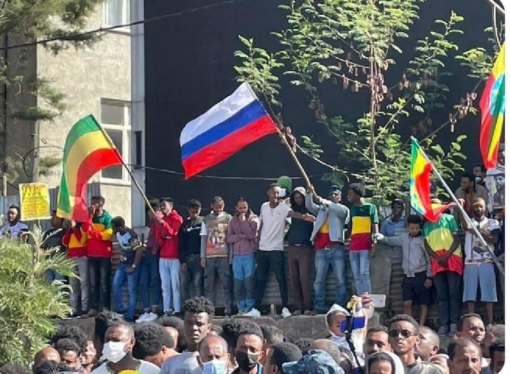 KassaHMariam's tweet photo. Ethiopians waving the Russian Flag at today’s Adwa commemorative rally in Addis Ababa. These are the people committing #TigrayGenocide. The holiday was supposed to commemorate a historical battle in which Tigrayans defeated the Italian invaders in 1896 @SecBlinken @USAmbUN https://t.co/fESwYELLps