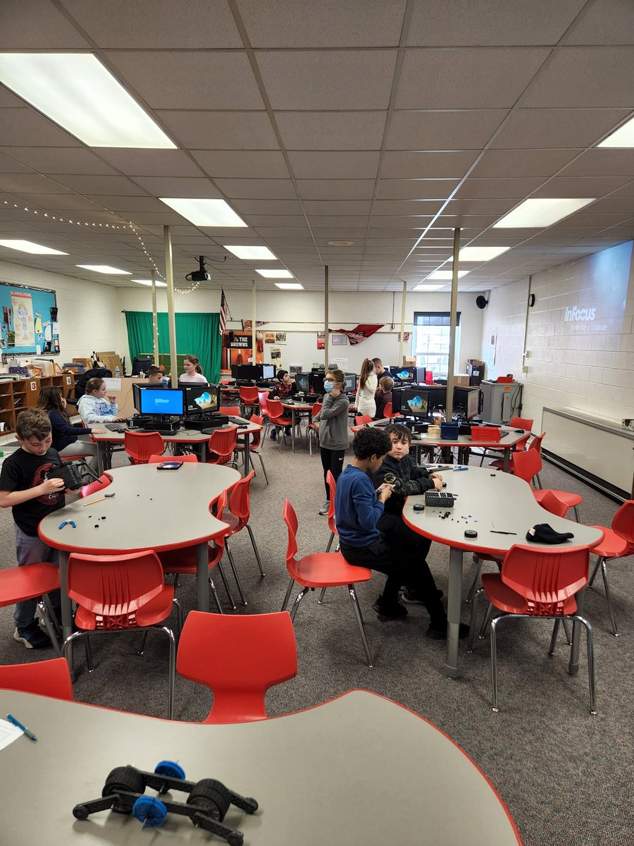 Using Vex kits to create a toy and presentations for a mock Shark Tank.