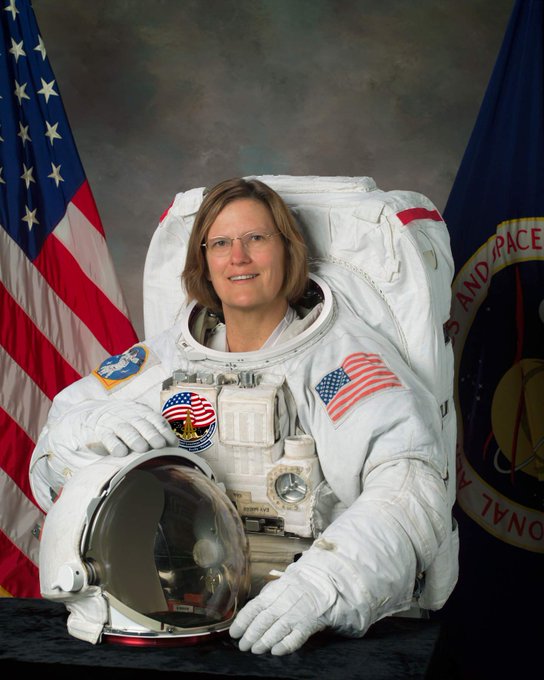 Kathy Sullivan in EVA spacesuit posed for official astronaut portrait 