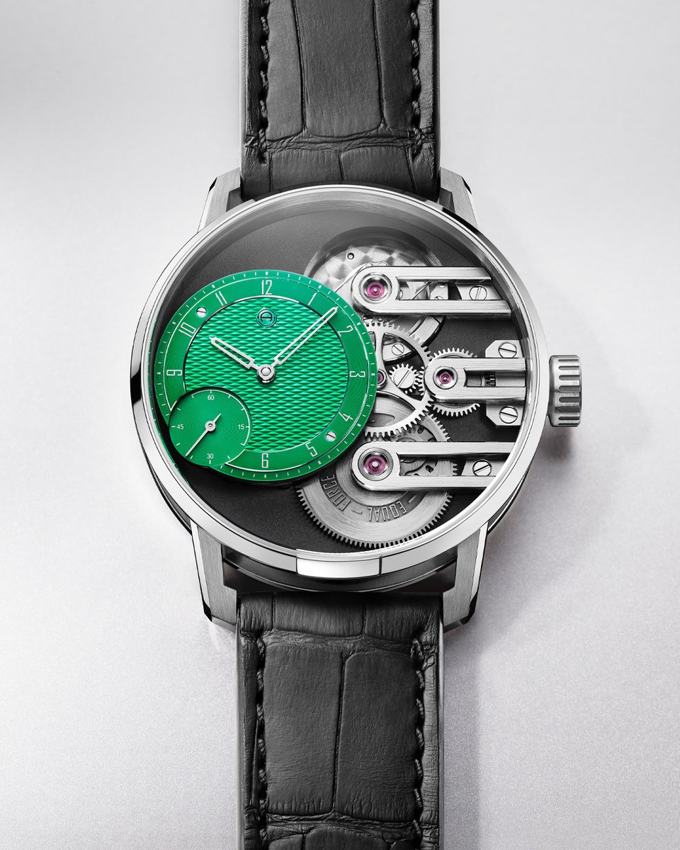 Exotic color meets avant-garde watchmaking: The new Gravity Equal Force Jungle Green features an off-center jungle green dial with a hand-guilloche pattern. A matt black PVD-coated movement plate offers a stark contrast to the dial, highlighting its luminosity. Limited to 15 pcs