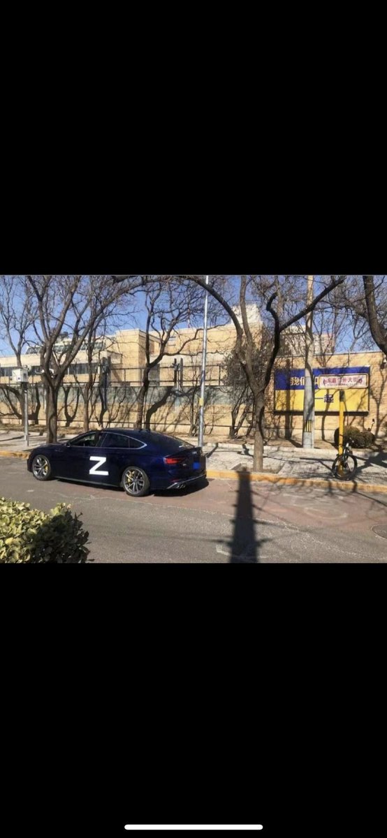 RussiaVUkrain's tweet photo. 🇷🇺🇺🇦🇨🇳 In Beijing, on a banner posted by the Canadian Embassy in support of Ukraine, the Chinese supported Russia.
 And on the streets of the capital of China there are cars with the designation Z. #UkraineRussiaWar #Ukraine https://t.co/yHbu95IgZo