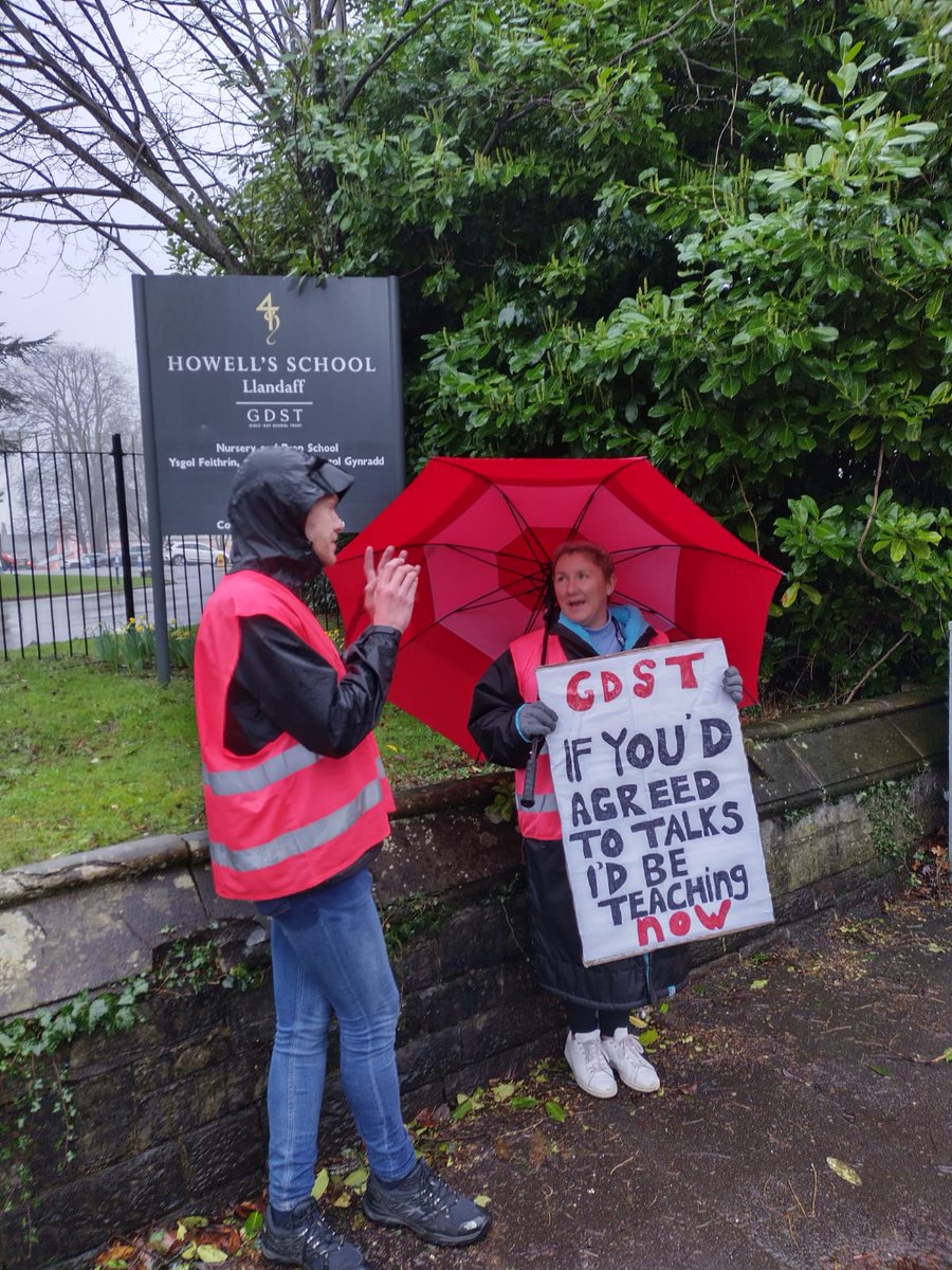 NEUCymru's tweet photo. The rain hasn't dampened the spirits of @NEUCymru members from @HowellsSchool who are on their 4th day of strike action as @GDST will not negotiate with ACAS @NEUnion #23Together #HandsOffOurTPS #StopFireRehire https://t.co/lJAGbg342s