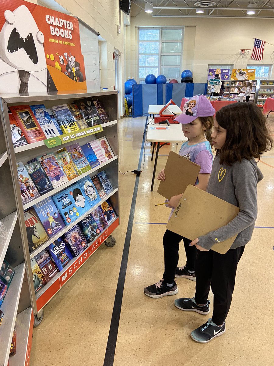 Exploring all the books at the Book Fair.  Super exciting