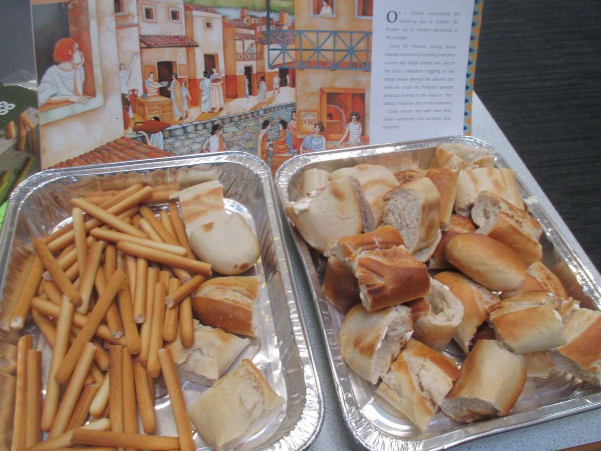 BeaconAcad's tweet photo. For #WorldBookDay Y4 are visiting Pompeii from our classroom. We were treated to some fresh, warm bread just like in the bakery in our #story. It really made us feel like we were there with the gorgeous smell! We have enjoyed acting out the story and writing poems. #reading https://t.co/qmnPIEJP4F